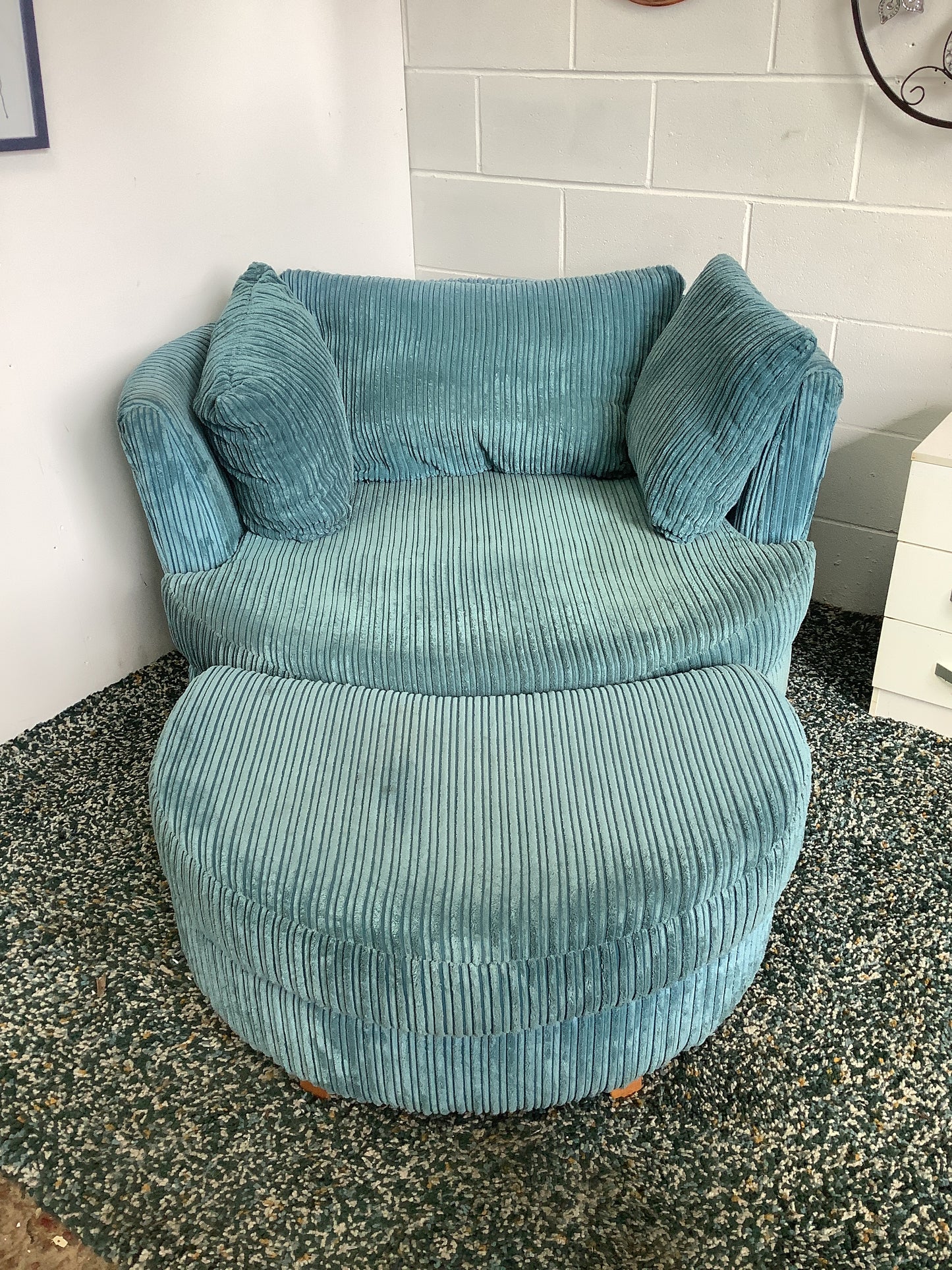 DFS Swivel snuggle chair with footstool