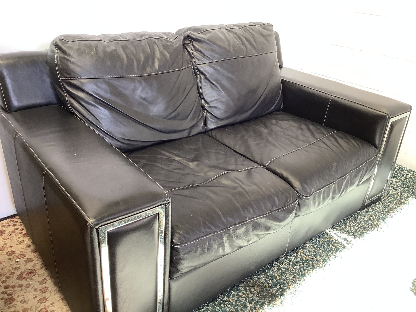 2 seater black leather sofa